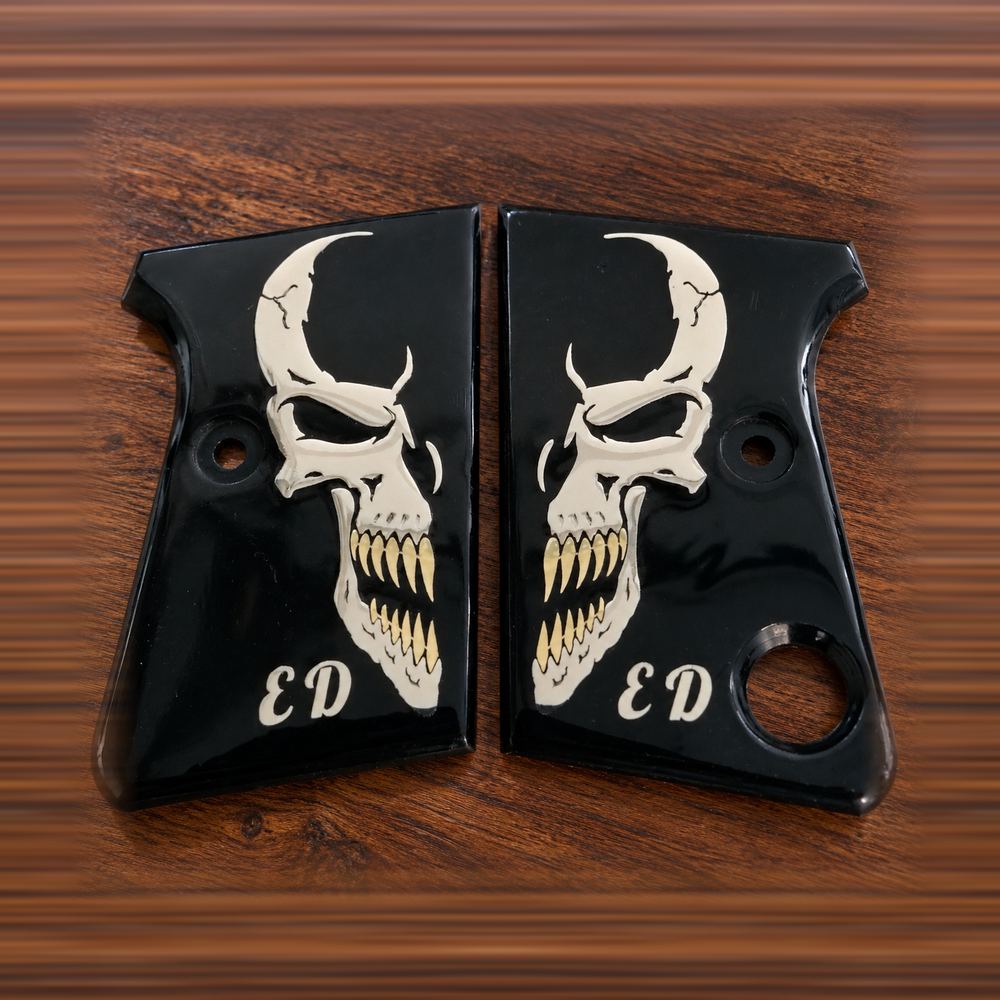 Custom engraved black acrylic pistol grips with horned skull and personal initials