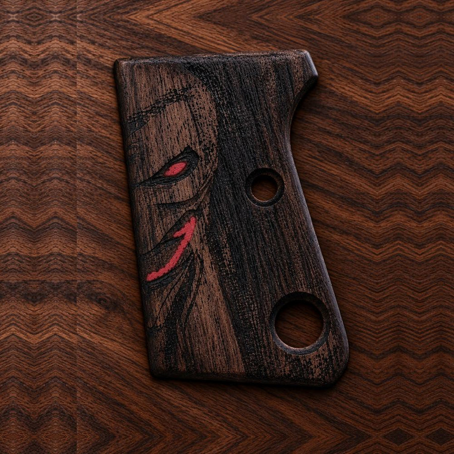 Astra Cub 6.35 dark walnut grips with carved demon face and red eye inlay – handcrafted Astra 2000 Cub & Colt Junior .25 pistol grips