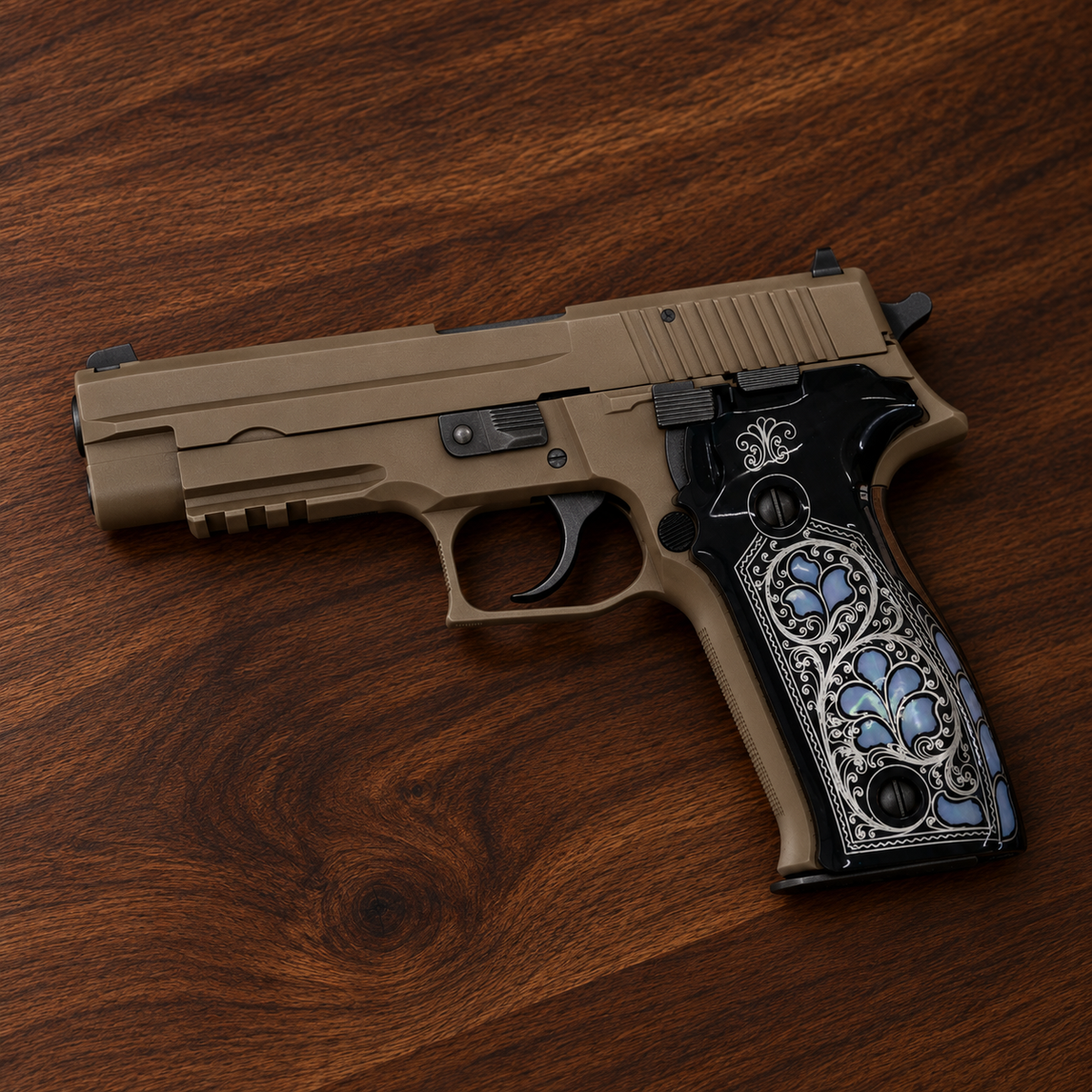 Sig Sauer P226 with black acrylic grips, mother of pearl inlay and silver engraved scrollwork, on walnut wood